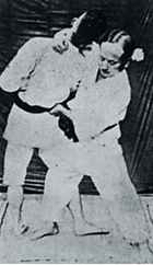 A person in white uniform holding another person in white uniform

AI-generated content may be incorrect.