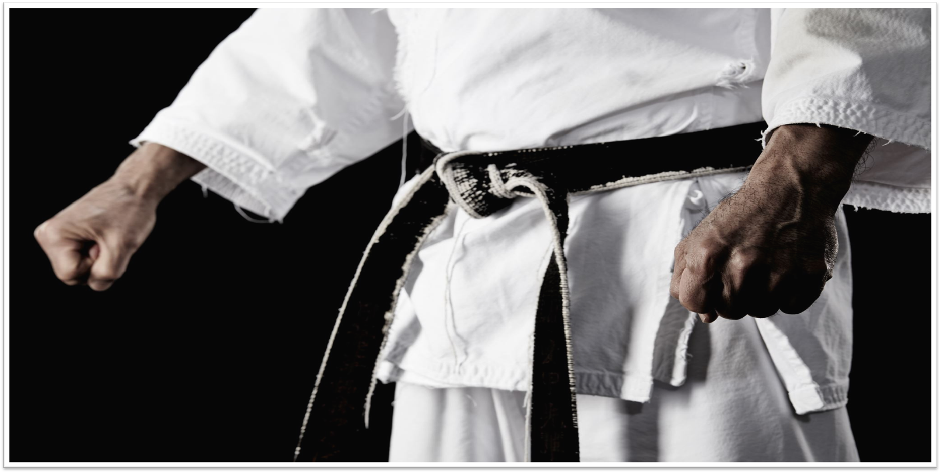 Close-up of a karate uniform with a black belt